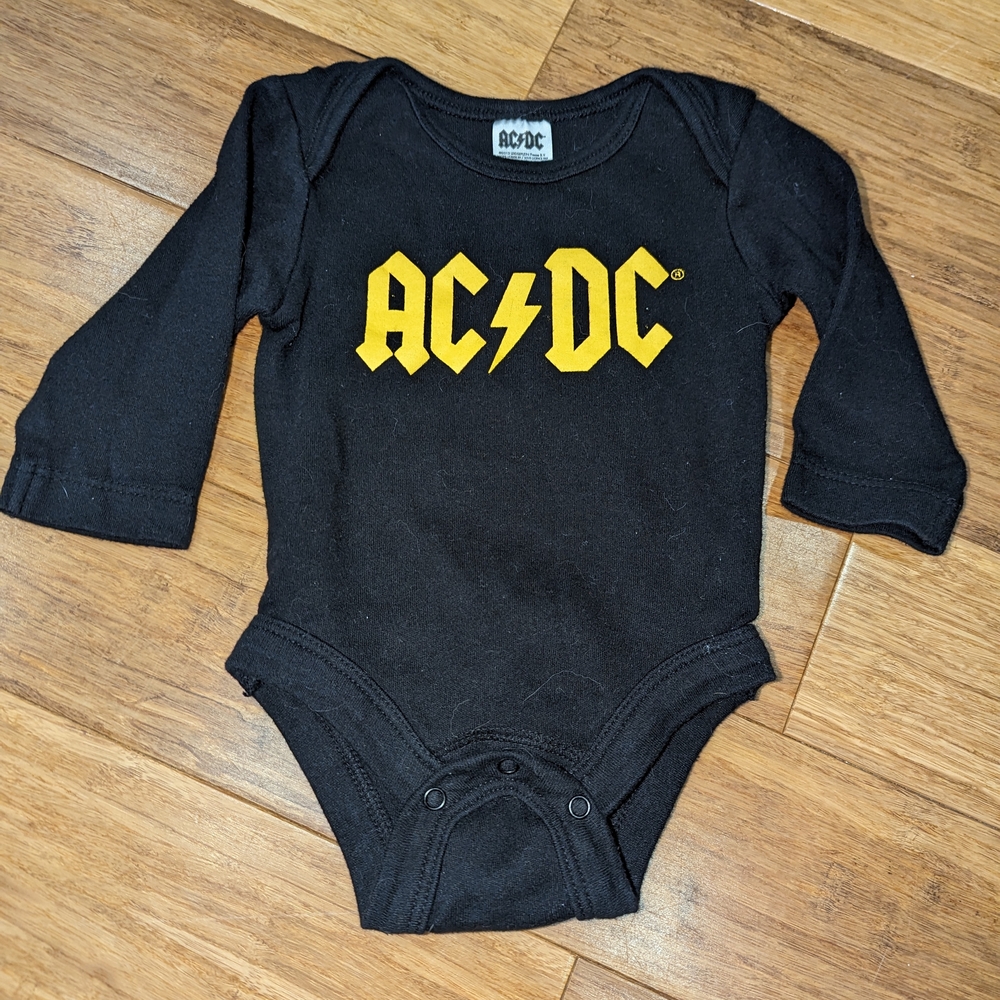 AC/DC Excellent condition, 3-6 months Black and Yellow Kids One Piece